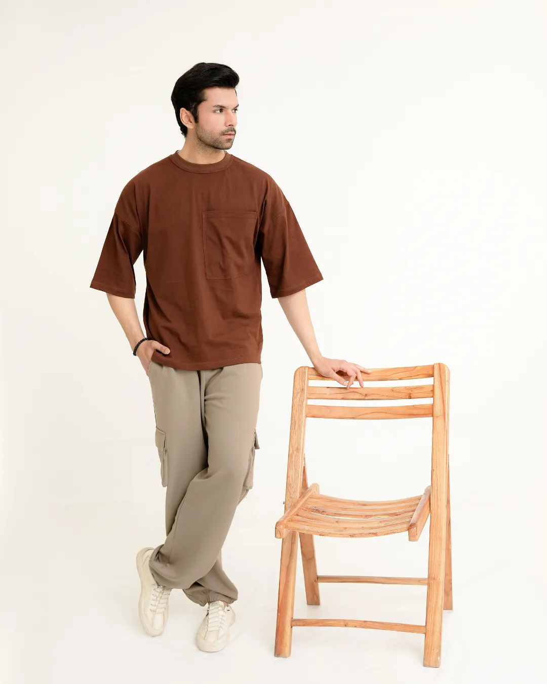 Brown Oversized Drop-Shoulder Shirt for Men 2 Brown Oversized T-Shirt Men Standing Chair Pose